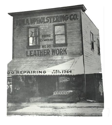 Historic black and white photo of an Upholstery Company building